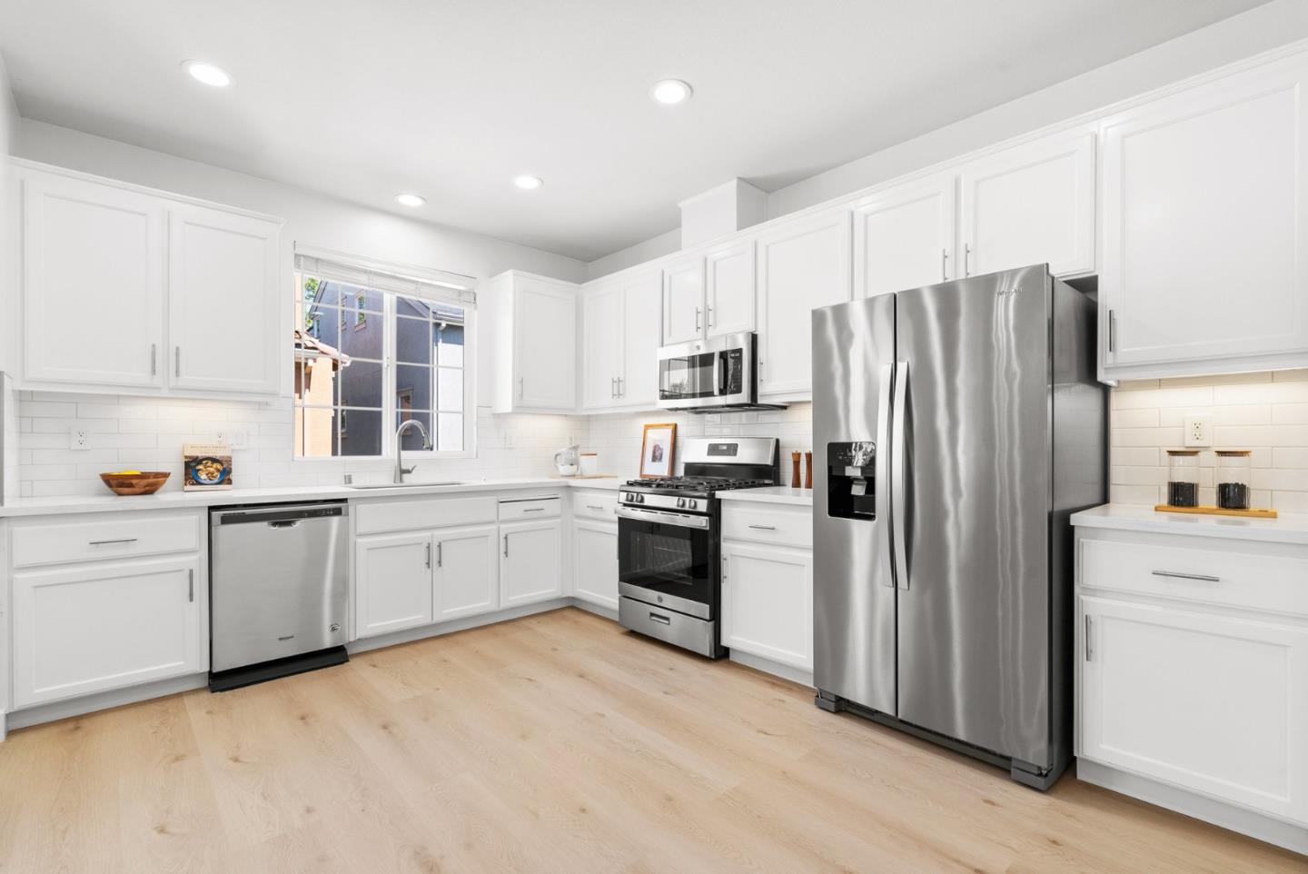 4337 Watson Circle Santa Clara, CA 95054 - Photo 14 of 55 a kitchen with granite countertop white cabinets and stainless steel appliances