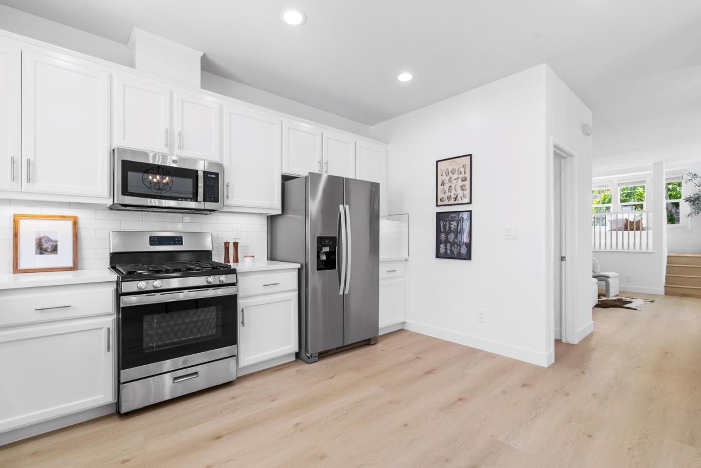 4337 Watson Circle Santa Clara, CA 95054 - Photo 17 of 55 a kitchen with stainless steel appliances a stove a microwave and a refrigerator