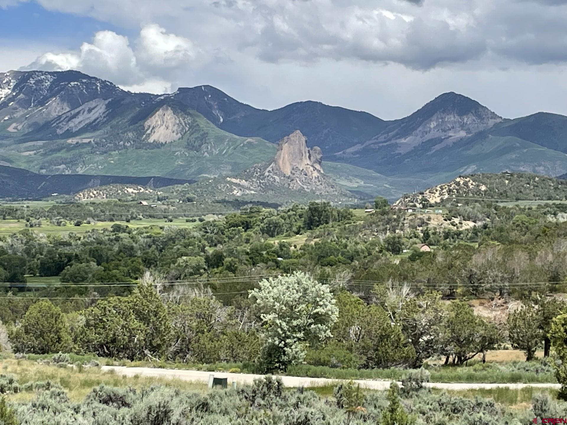 Lot 8 D Road Crawford, CO 81415 - Photo 2 of 14 a view of a house with a mountain and a forest