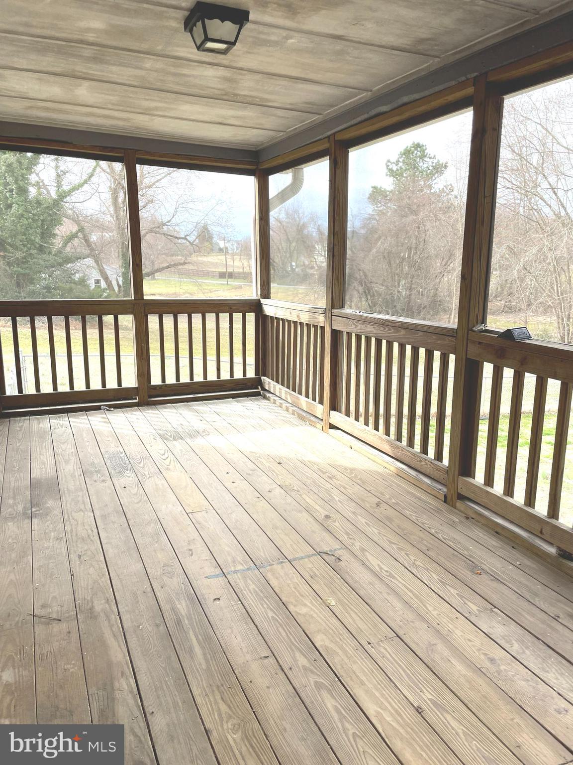 6816 Old Solomons Island Road Friendship, MD 20758 - Photo 18 of 26 Screened Porch off Kitchen