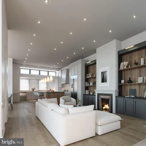 a living room with furniture wooden floor and a fireplace