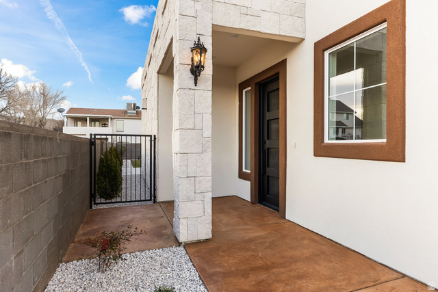226 East 1100 North Hurricane, UT 84737 - Photo 13 of 49 Doorway to property with a gate and stucco siding