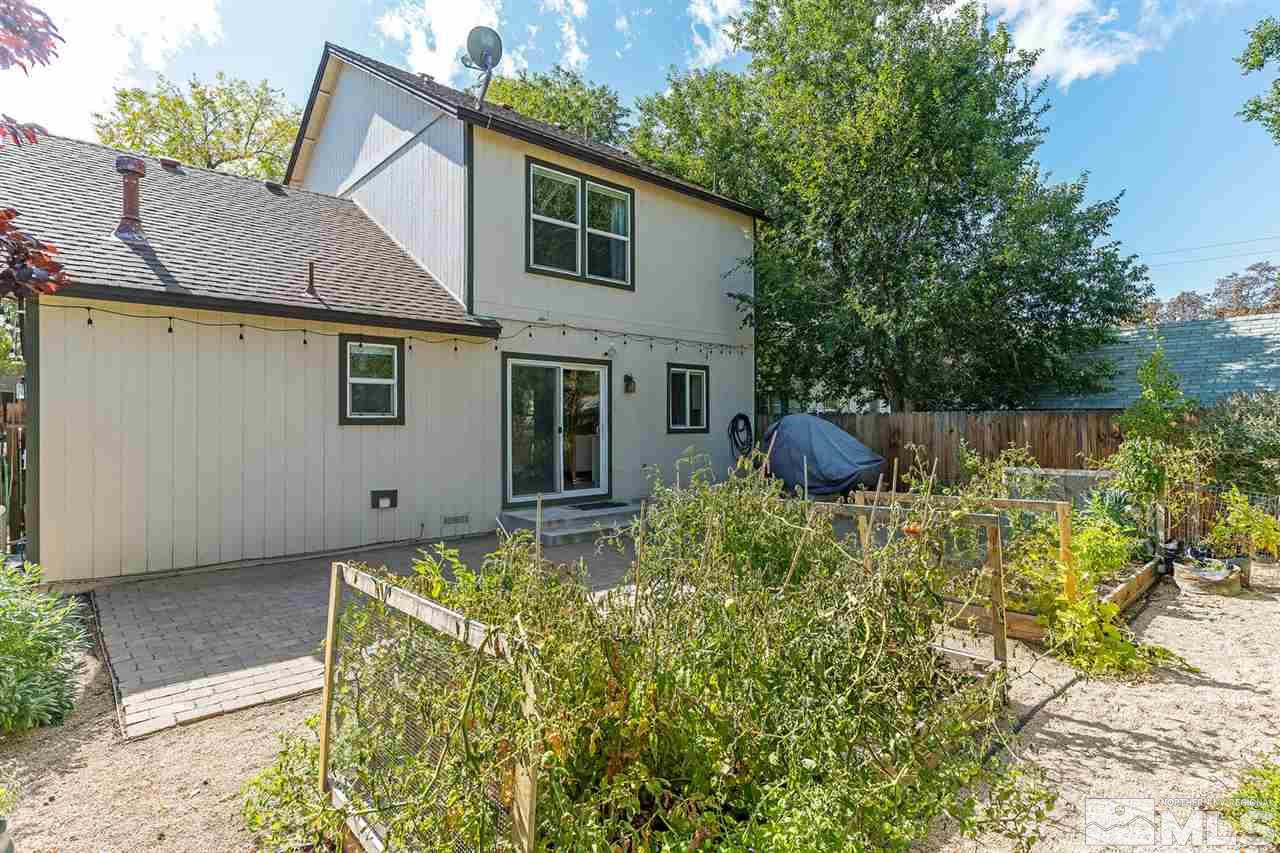 441 Mt Rose Street Reno, NV 89509 - Photo 20 of 21 a backyard of a house with plants and large tree