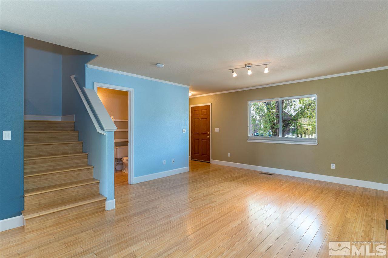 441 Mt Rose Street Reno, NV 89509 - Photo 5 of 21 a view of an empty room with wooden floor and a window