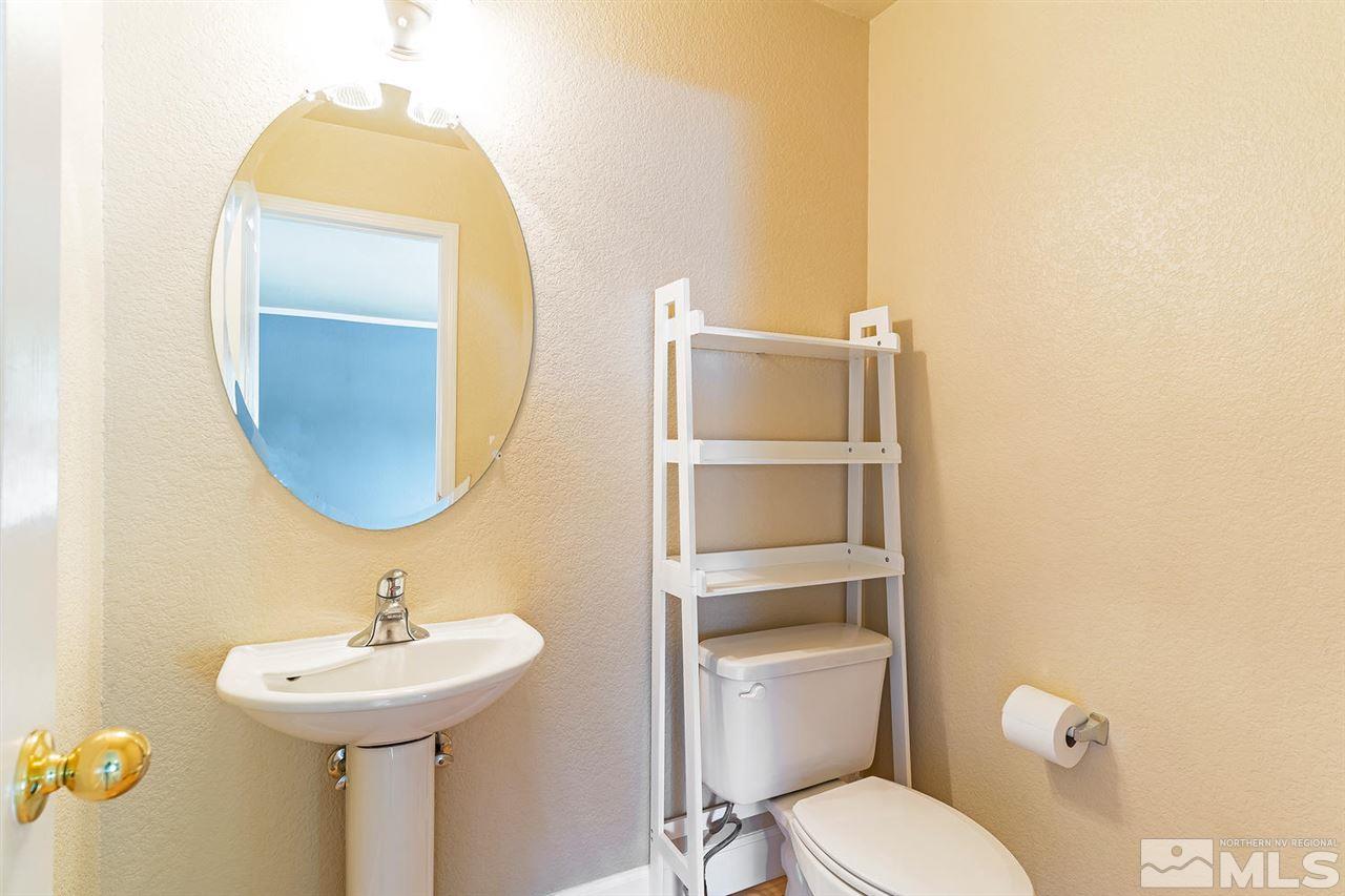 441 Mt Rose Street Reno, NV 89509 - Photo 7 of 21 a bathroom with a toilet sink and mirror