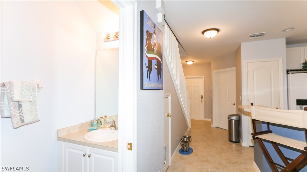 11709 Eros Road Lehigh Acres, FL 33971 - Photo 10 of 25 a bathroom with a sink double vanity