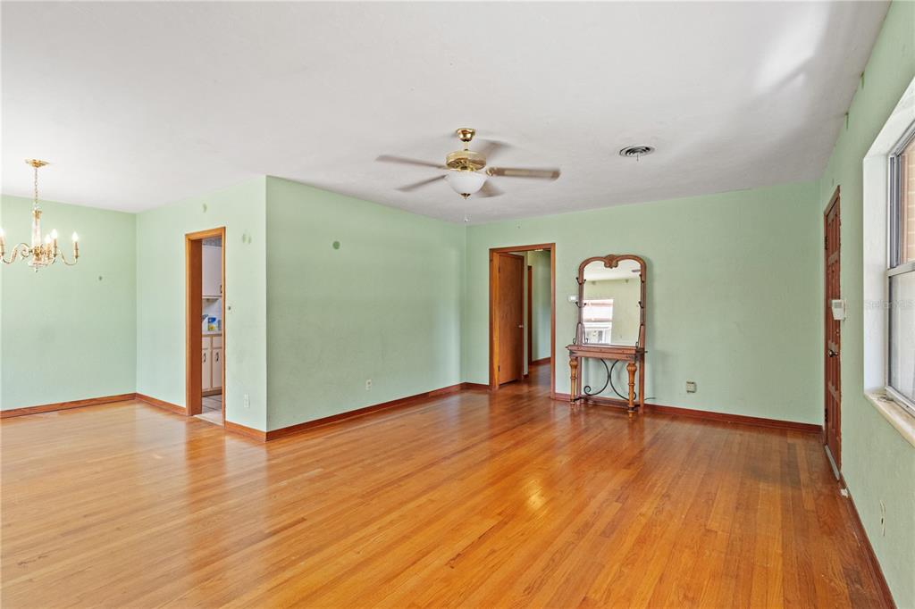 2236 Southeast 8th Avenue Ocala, FL 34471 - Photo 14 of 49 a view of empty room with wooden floor and fan