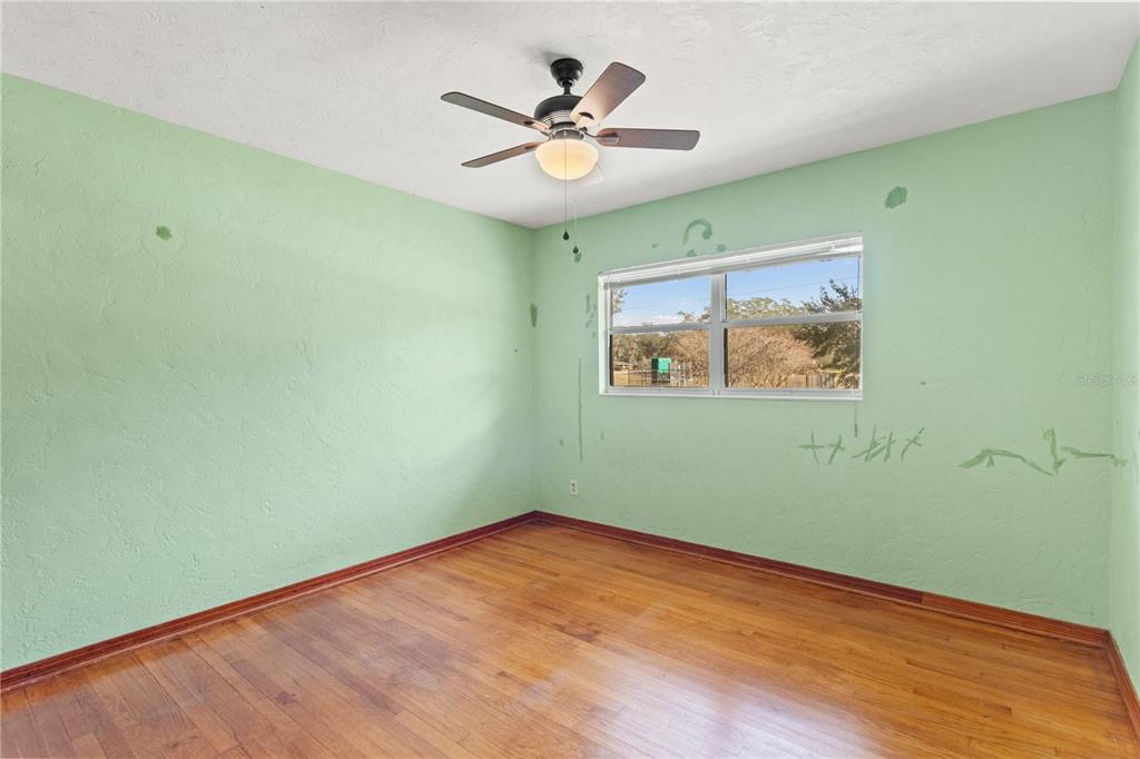 2236 Southeast 8th Avenue Ocala, FL 34471 - Photo 16 of 49 an empty room with a window and a fan