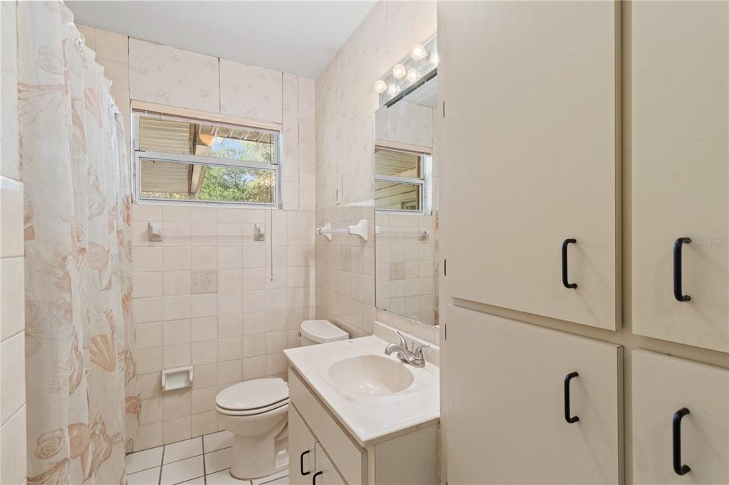 2236 Southeast 8th Avenue Ocala, FL 34471 - Photo 17 of 49 a bathroom with a sink toilet and shower