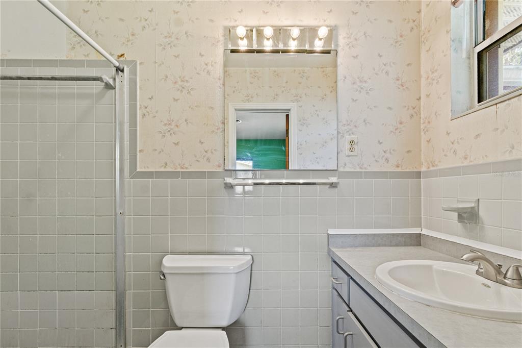 2236 Southeast 8th Avenue Ocala, FL 34471 - Photo 24 of 49 a bathroom with a toilet sink and mirror