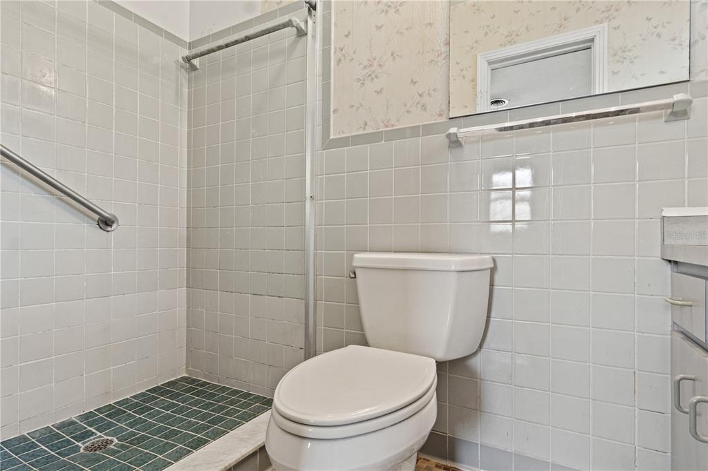 2236 Southeast 8th Avenue Ocala, FL 34471 - Photo 25 of 49 a white toilet sitting next to a bathroom sink