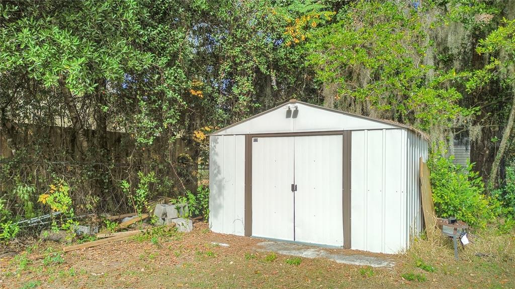 2236 Southeast 8th Avenue Ocala, FL 34471 - Photo 32 of 49 a side view of a house with a yard