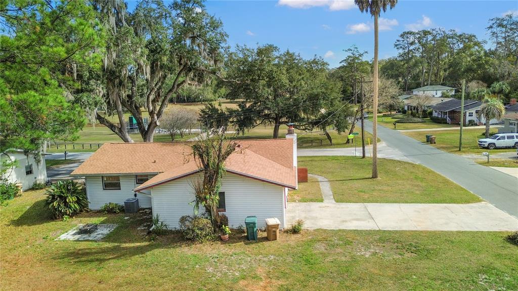2236 Southeast 8th Avenue Ocala, FL 34471 - Photo 40 of 49 an aerial view of a house with swimming pool and trees