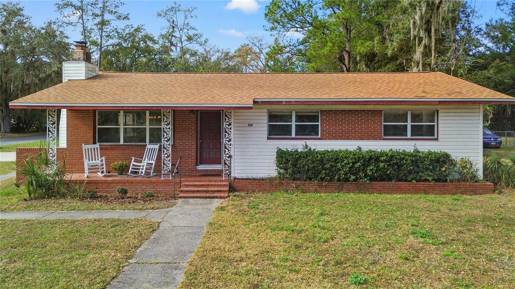 2236 Southeast 8th Avenue Ocala, FL 34471 - Photo 4 of 49 a front view of a house with garden