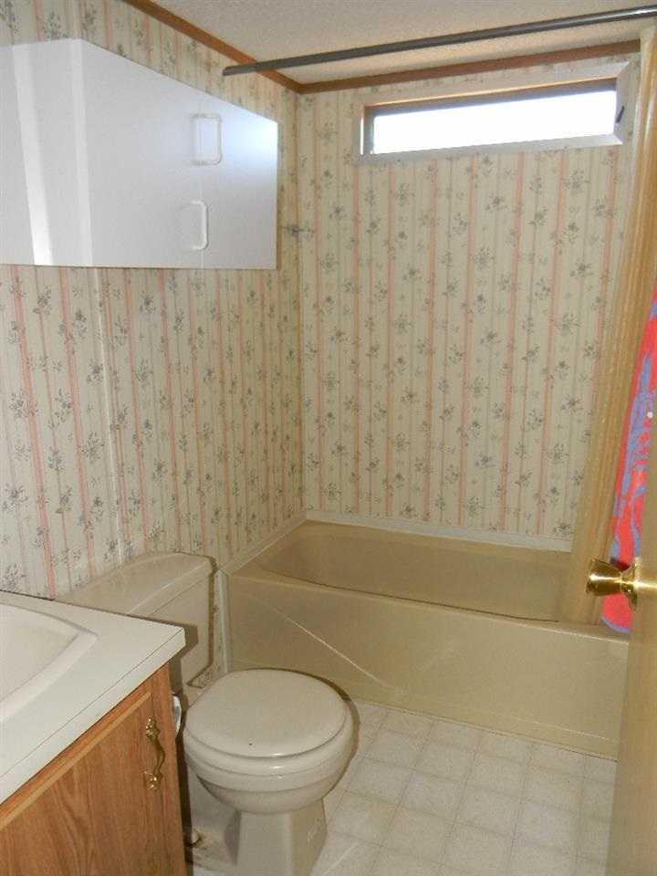 4180 Stirrup Road Snowflake, AZ 85937 - Photo 8 of 11 a bathroom with a sink a toilet and a shower