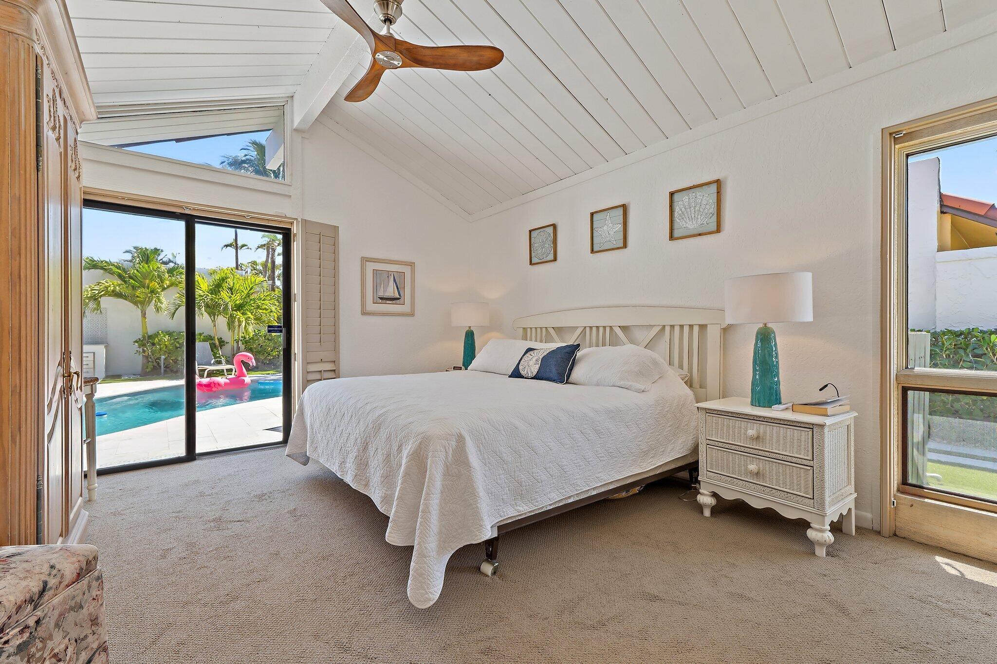 131 Bonefish Circle Jupiter, FL 33477 - Photo 21 of 48 a bed sitting in a bedroom next to a window