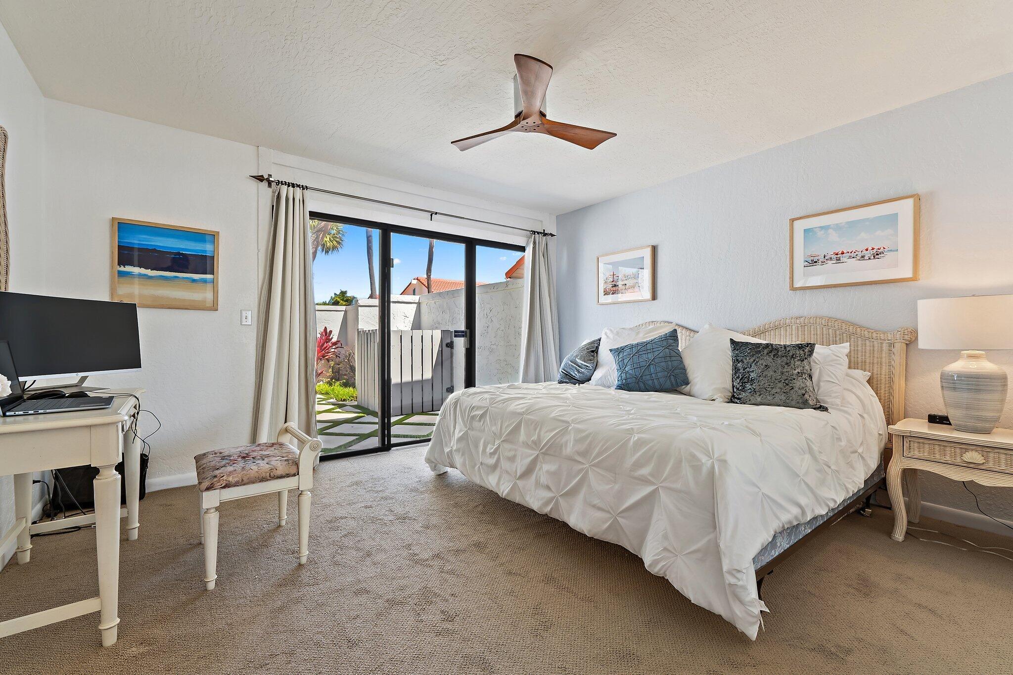 131 Bonefish Circle Jupiter, FL 33477 - Photo 26 of 48 a bedroom with a bed and a desk