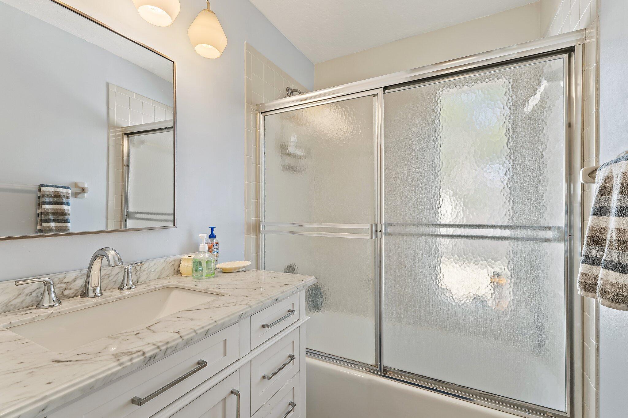 131 Bonefish Circle Jupiter, FL 33477 - Photo 27 of 48 a bathroom with a granite countertop sink mirror and double