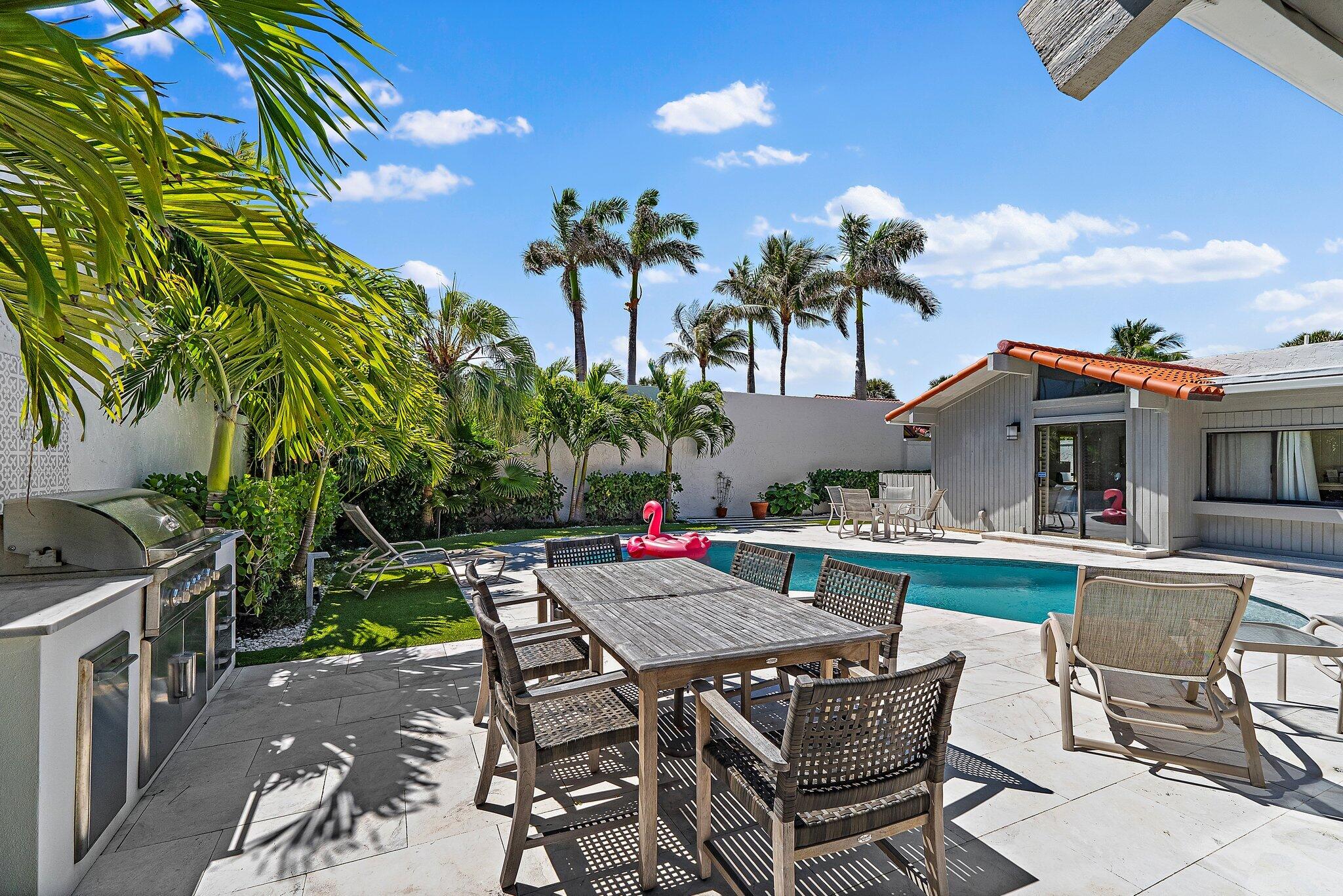 131 Bonefish Circle Jupiter, FL 33477 - Photo 42 of 48 a view of a dinning table and chairs in patio