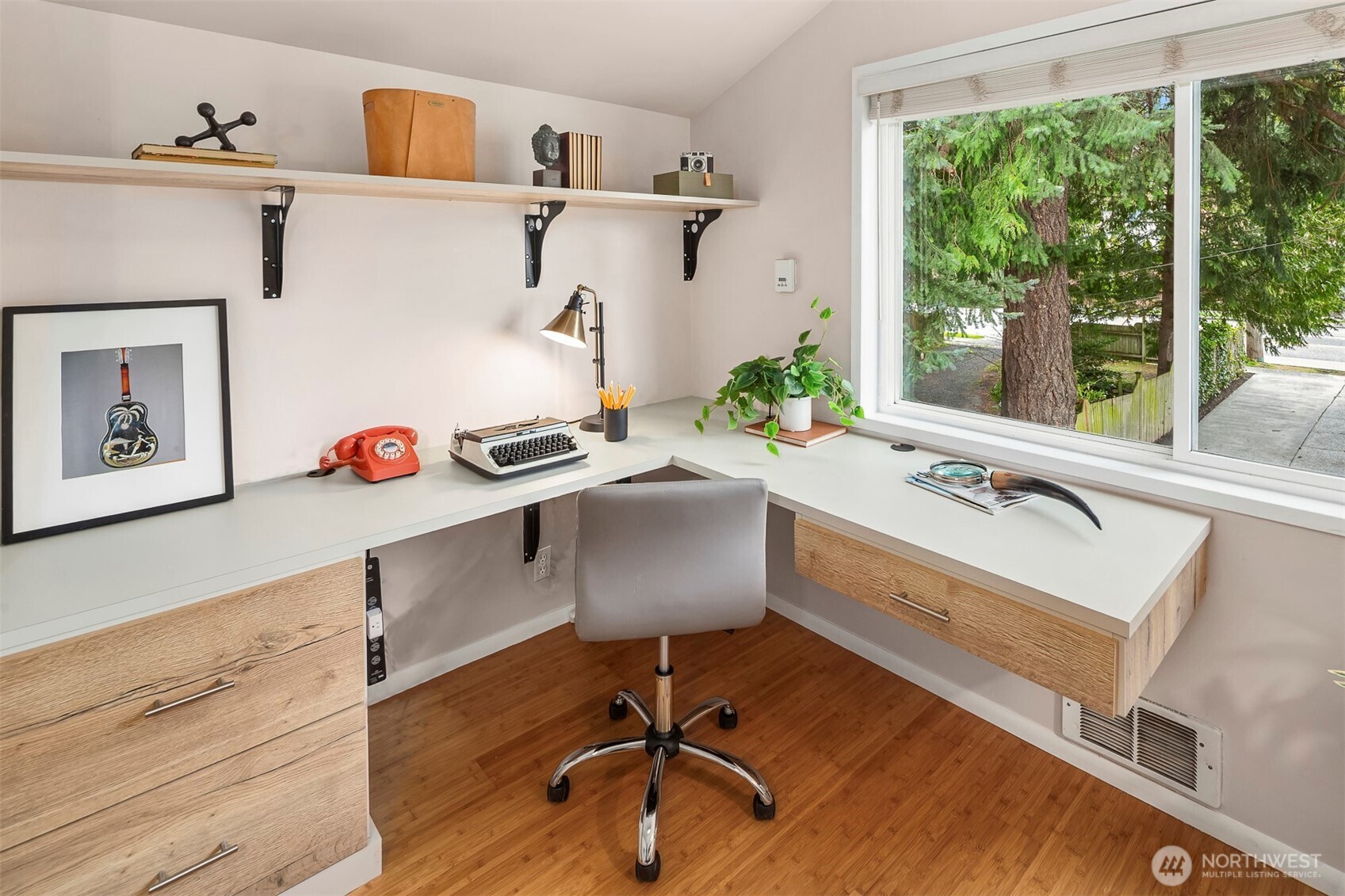 6939 Fauntleroy Way Southwest Seattle, WA 98136 - Photo 22 of 35 a view of a workspace with furniture and a window