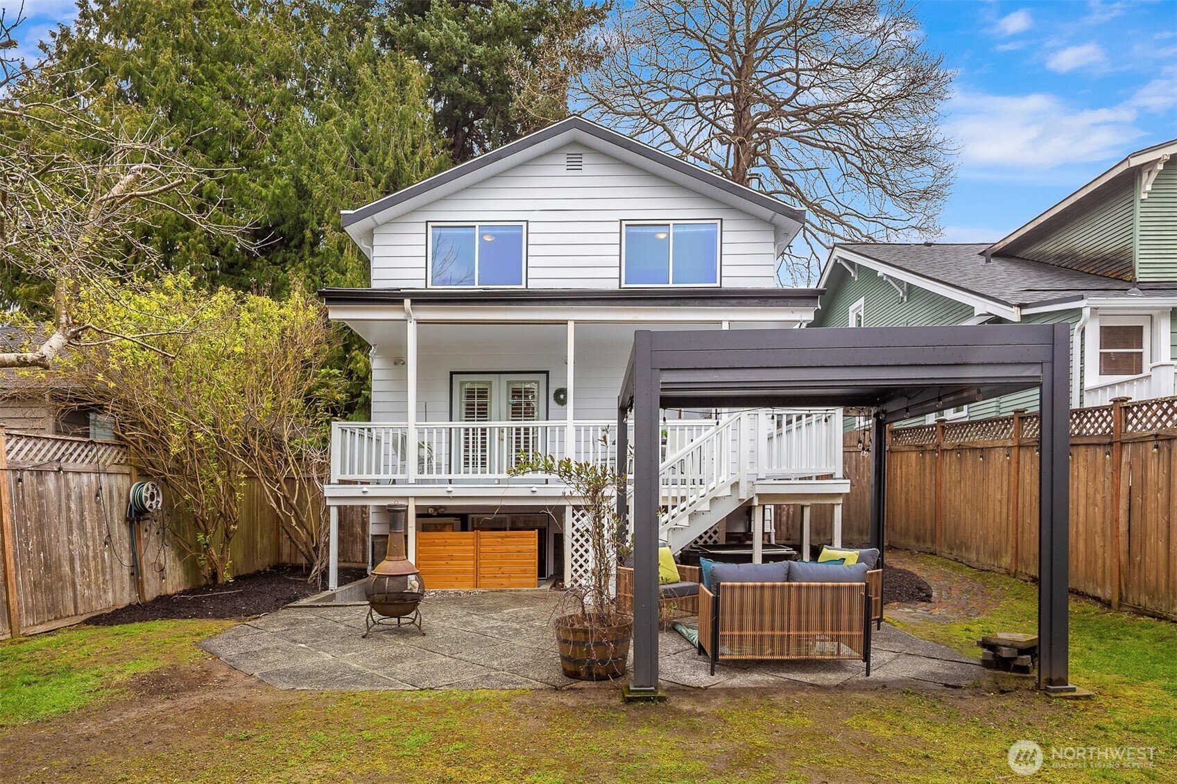 6939 Fauntleroy Way Southwest Seattle, WA 98136 - Photo 30 of 35 a view of a house with a small yard and large tree