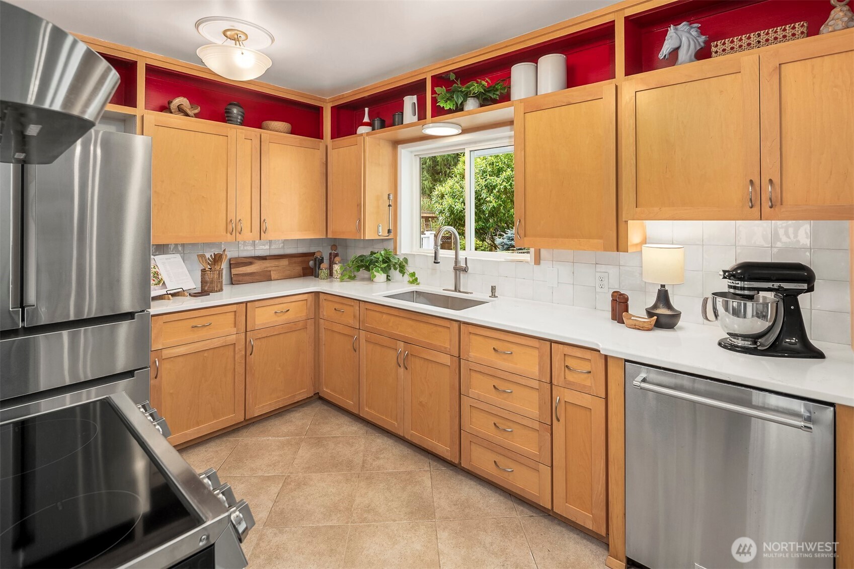 6939 Fauntleroy Way Southwest Seattle, WA 98136 - Photo 10 of 35 a kitchen with a sink cabinets and window