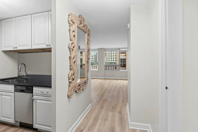 a kitchen with a sink and cabinets