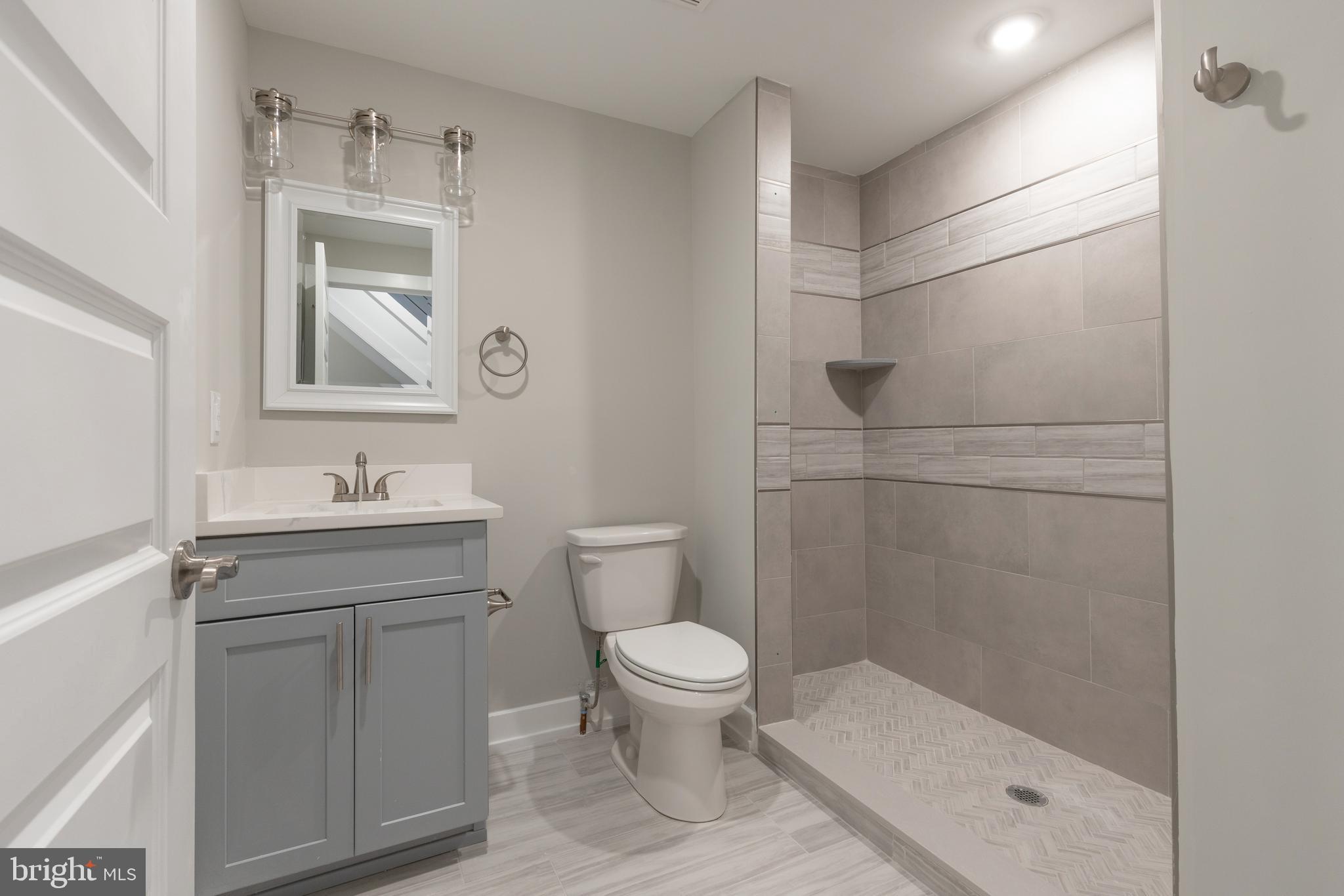 140 West Huntingdon Street, Unit 2 Philadelphia, PA 19133 - Photo 13 of 28 a bathroom with a sink a toilet and shower