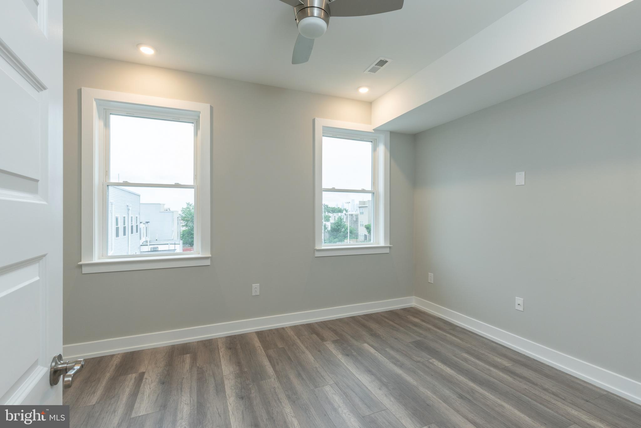 140 West Huntingdon Street, Unit 2 Philadelphia, PA 19133 - Photo 16 of 28 an empty room with windows
