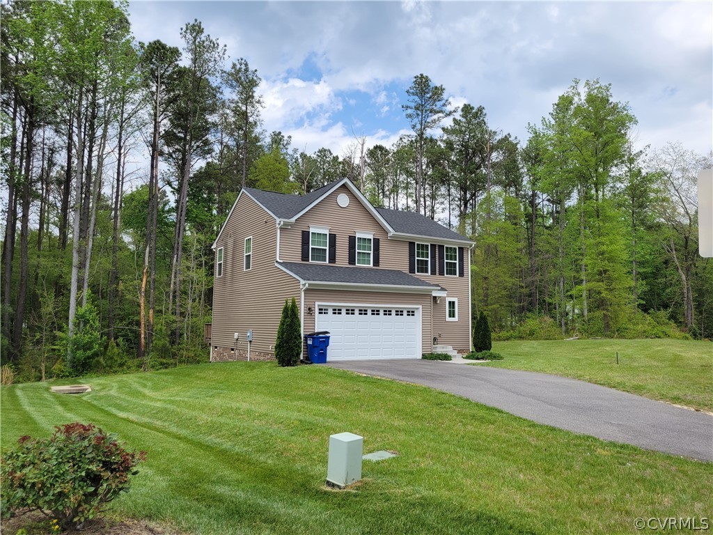 10106 Sandy Ridge Drive Chesterfield, VA 23832 - Photo 28 of 29 a front view of a house with a yard and garage