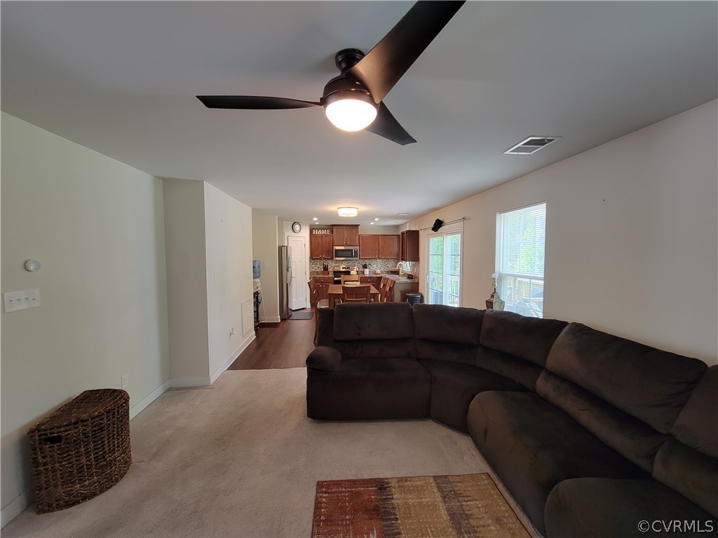 10106 Sandy Ridge Drive Chesterfield, VA 23832 - Photo 5 of 29 a living room with furniture and a chandelier
