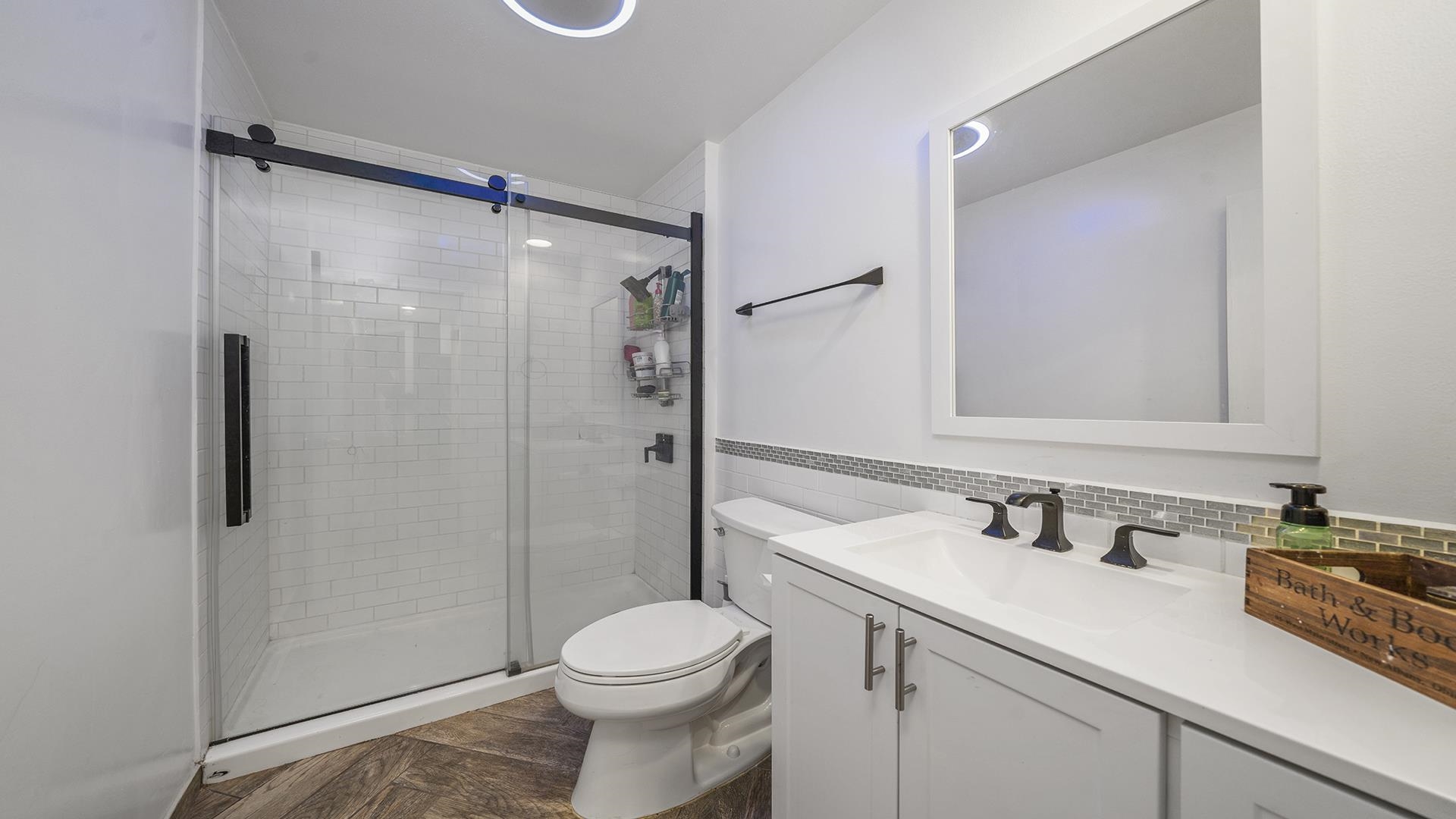 1050 South Trainer Road Rockford, IL 61108 - Photo 18 of 33 a bathroom with a sink toilet and shower