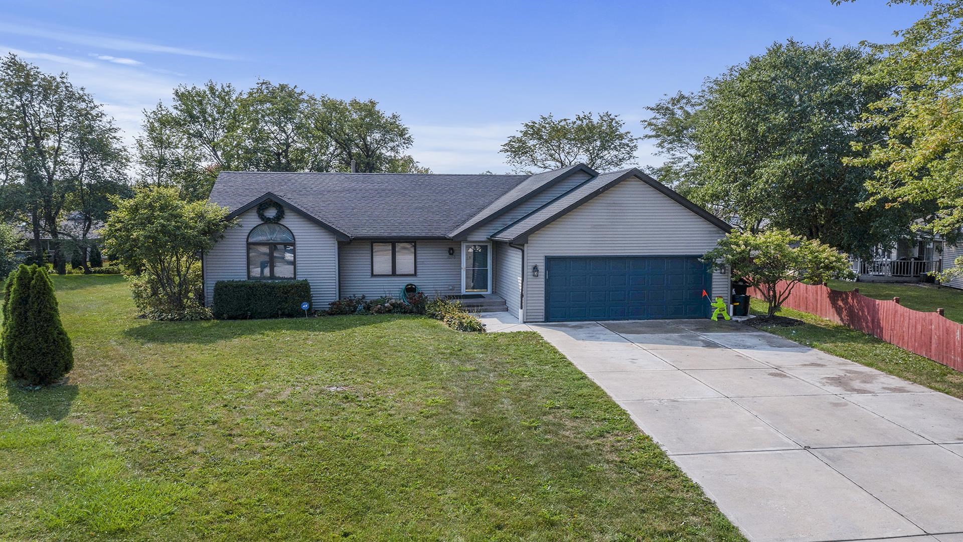 1050 South Trainer Road Rockford, IL 61108 - Photo 2 of 33 a front view of a house with a yard and trees