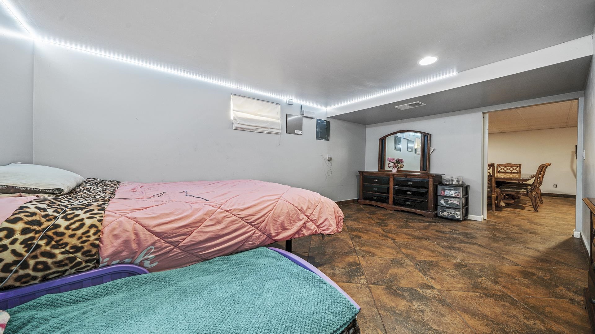 1050 South Trainer Road Rockford, IL 61108 - Photo 23 of 33 a bed room with a bed and a television