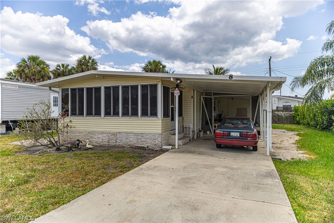 a view of house with outdoor space and swimming pool