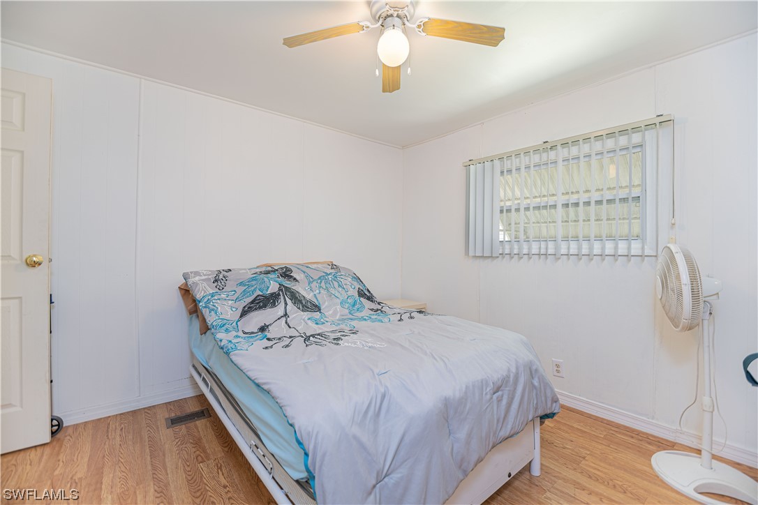 8 Henderson Drive Naples, FL 34114 - Photo 12 of 16 a bedroom with a bed and a window