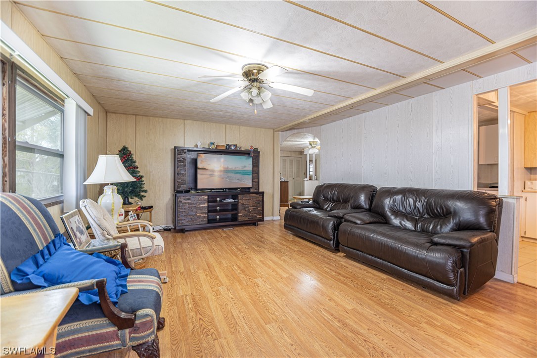 8 Henderson Drive Naples, FL 34114 - Photo 3 of 16 a view of a livingroom with furniture and a flat screen tv