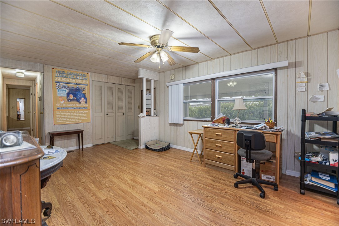 8 Henderson Drive Naples, FL 34114 - Photo 5 of 16 a view of a livingroom with workspace and a window