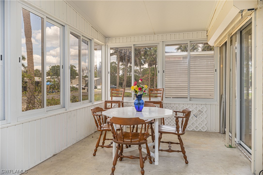 8 Henderson Drive Naples, FL 34114 - Photo 6 of 16 a dining room with furniture and window
