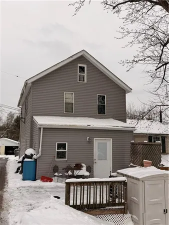 a front view of house with yard outdoor seating and barbeque oven
