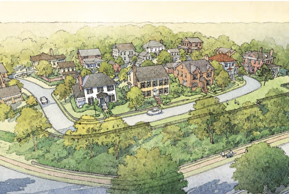 an aerial view of residential houses with outdoor space and trees