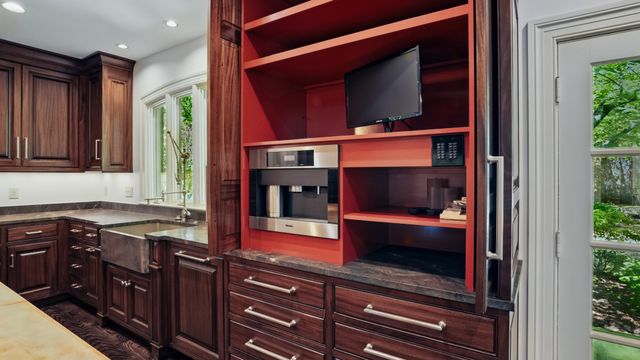 a bathroom with a sink mirror and vanity