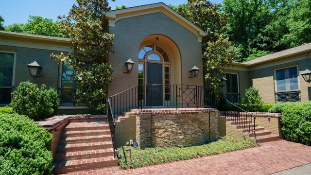 a front view of house with street