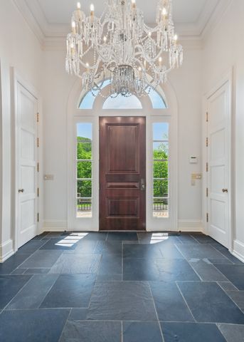 a view of livingroom with furniture wooden floor and front door