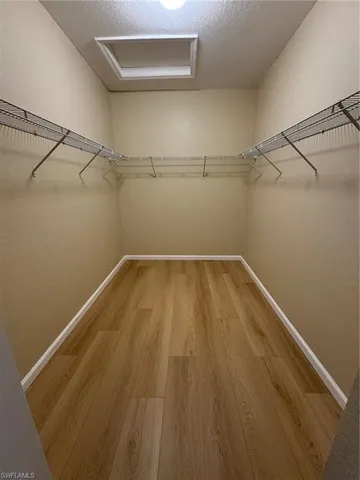 a bathroom with a sink a mirror and a shower