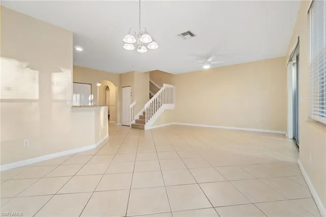 a kitchen with stainless steel appliances granite countertop a refrigerator sink and microwave