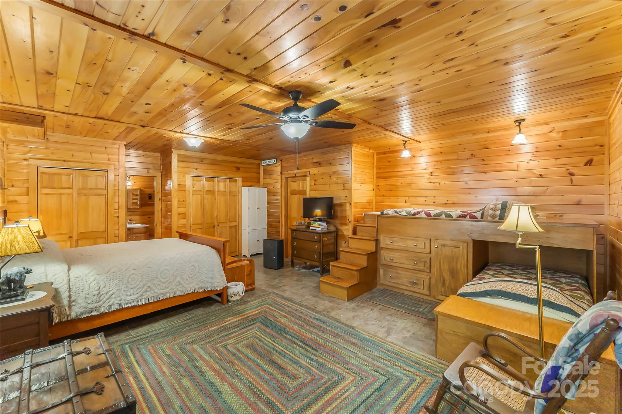 6151 Hemlock Road Newland, NC 28657 - Photo 18 of 43 a bedroom with a bed and wooden floor