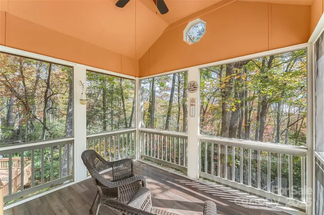 a view of backyard with barbeque grill and outdoor seating