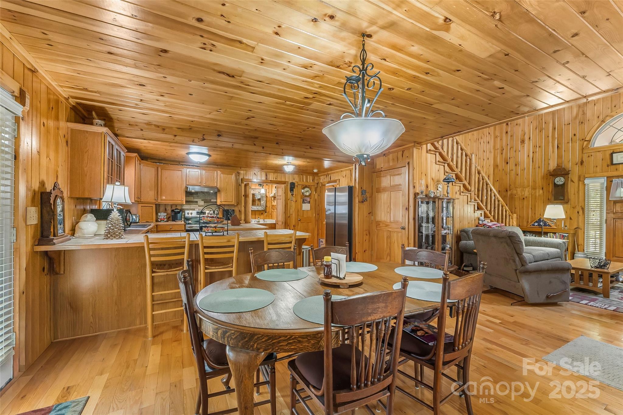6151 Hemlock Road Newland, NC 28657 - Photo 3 of 43 a view of a dining room with furniture window and wooden floor