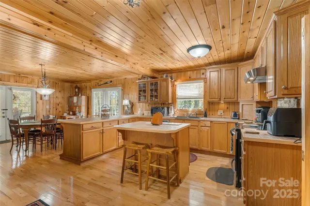 a kitchen with lots of counter top space and dining table